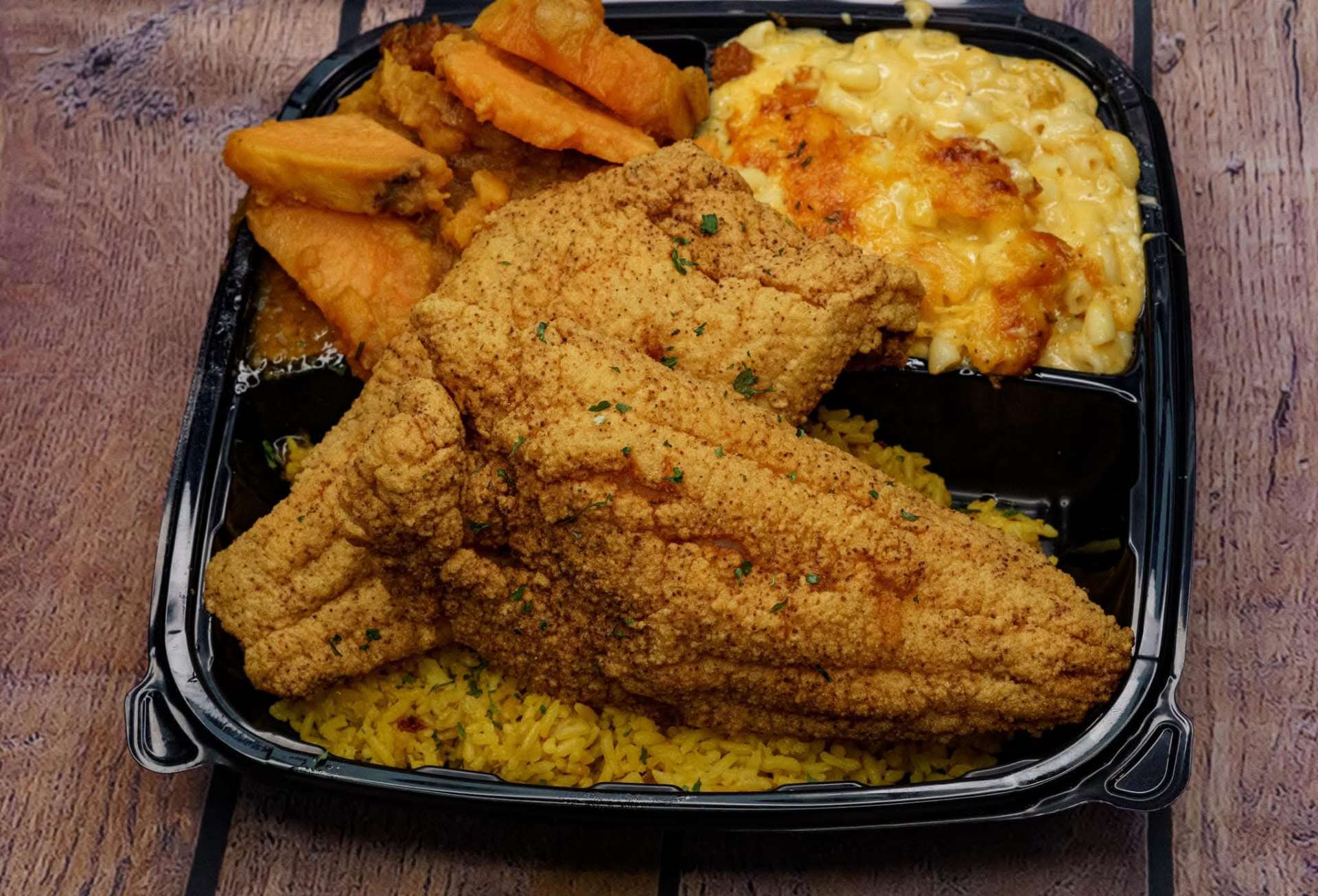Crispy fried catfish with candied yams and baked mac & cheese