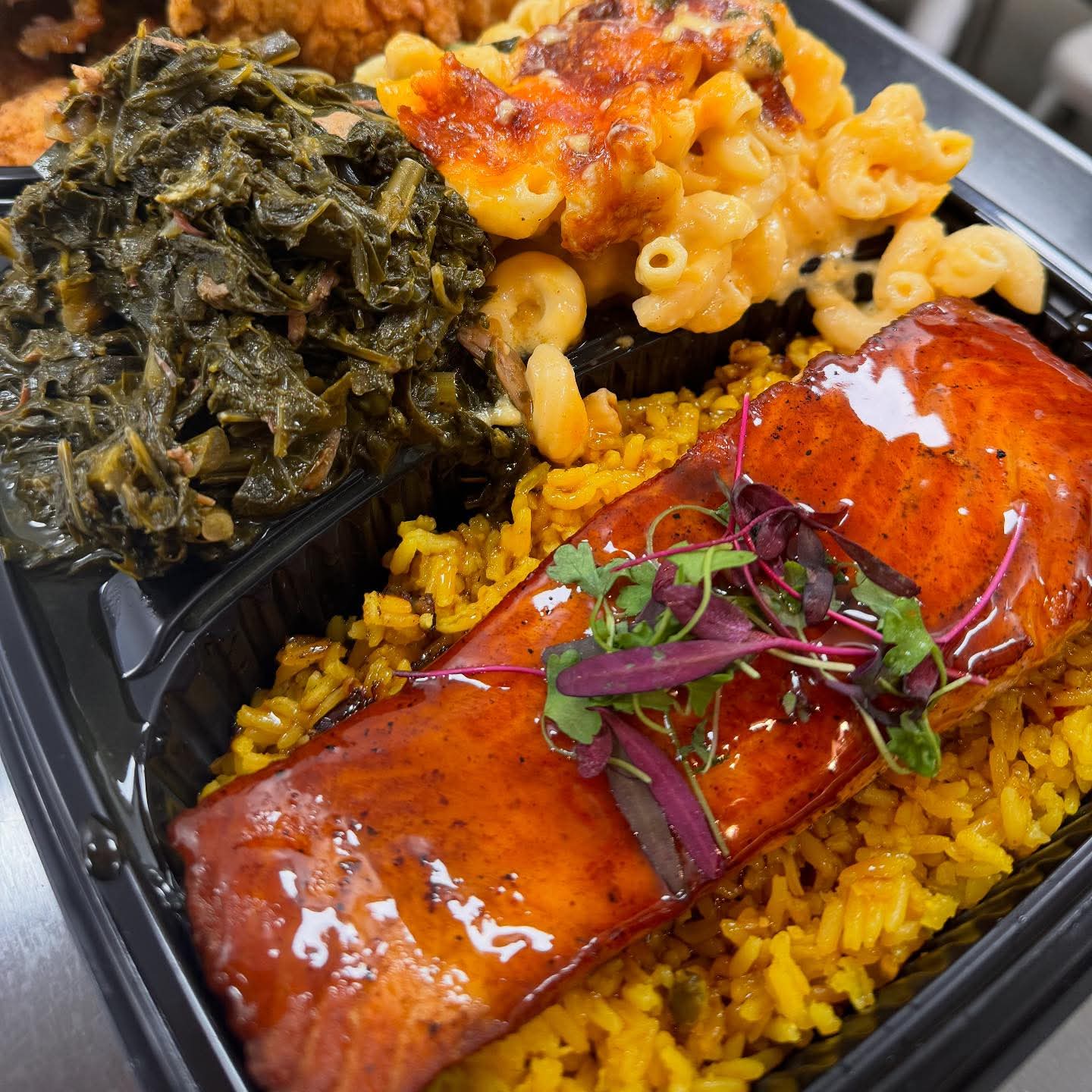 StuffedEnuff signature plate: glazed salmon over saffron rice with collard greens and baked mac & cheese